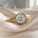 Elegant Gold Halo Ring with Round-Cut Sparkling Center Stone Luxury Gold Halo Ring with Starburst Details